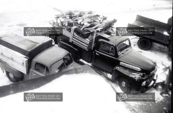 A gritty, snow-covered snapshot of post-hunt pride in classic 1950s Wisconsin style.