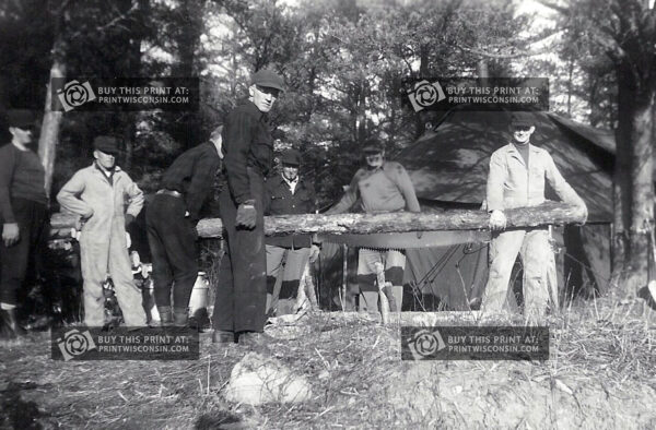 Historic photo of Wisconsin hunters prepping deer camp in the 1950s. A rare behind-the-scenes look at tradition and teamwork, printed on high-gloss acrylic.